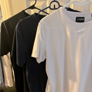 Cuts t-shirts in White, Blue, and black. Never worn $20 each or $50 for all 3